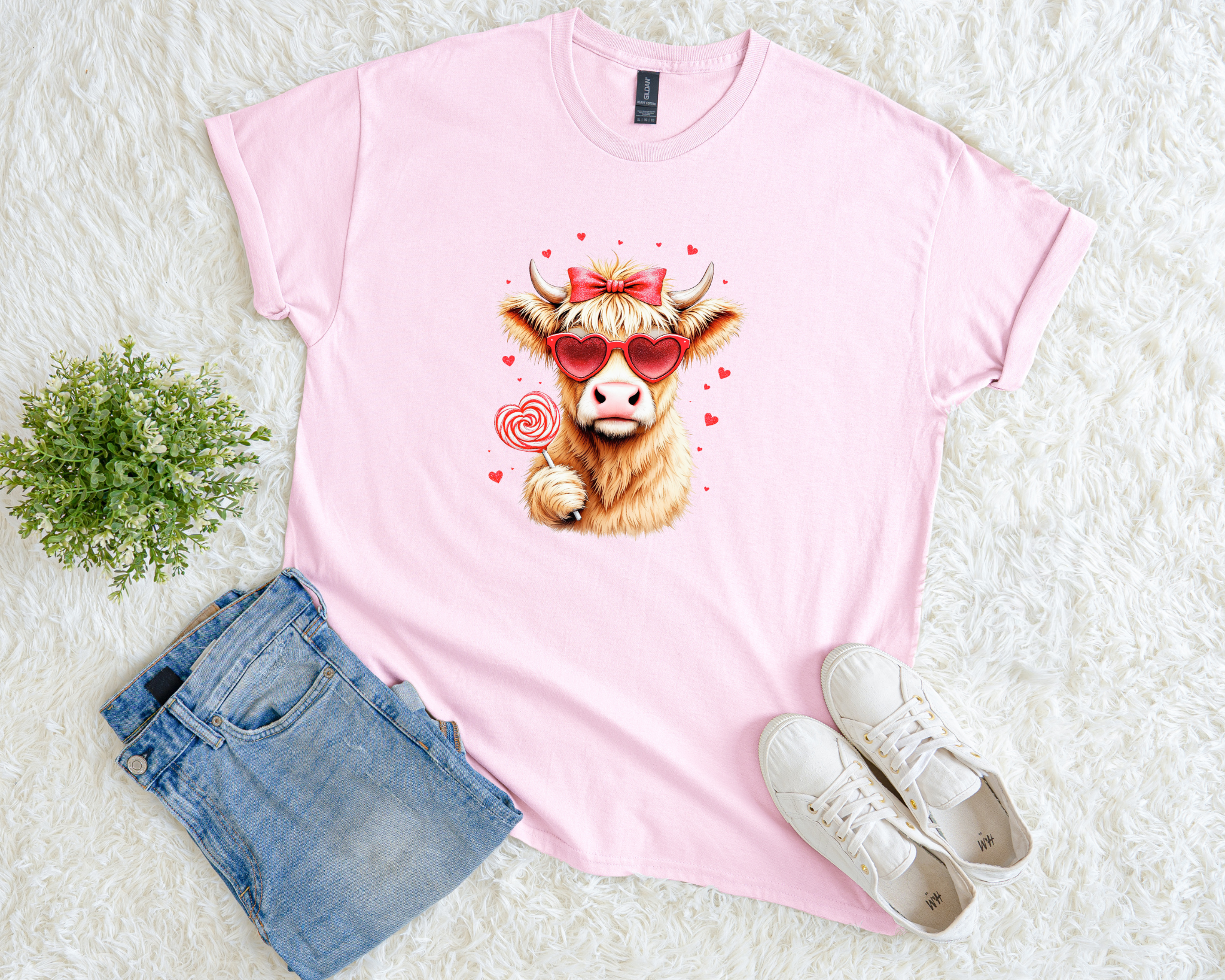 Adorable Highland cow Valentine’s shirt featuring heart sunglasses and lollipop. Perfect pink graphic tee for Valentine’s Day, gifts, and cow lovers.