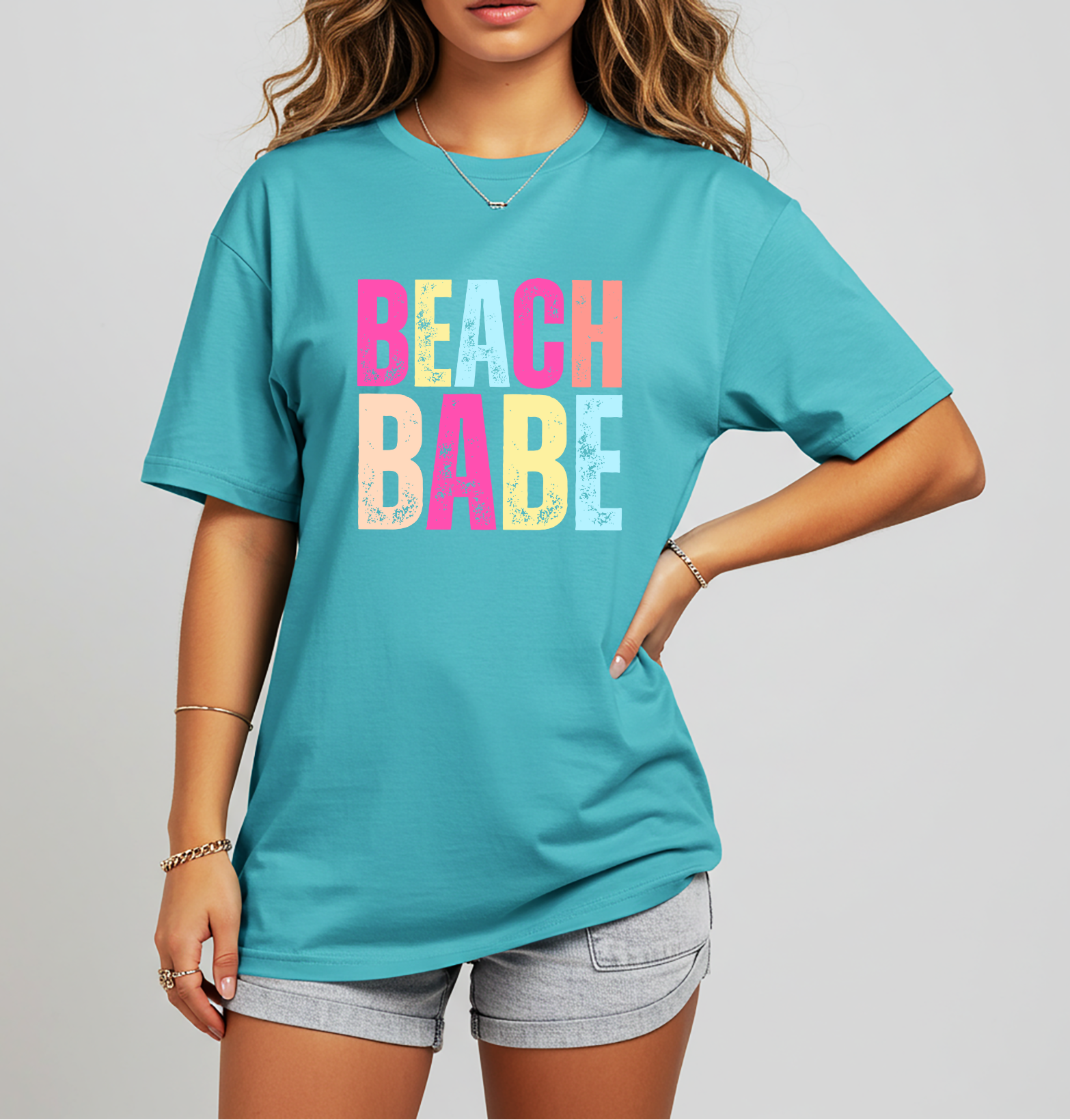 Beach Babe graphic tee with colorful retro block lettering. Cute summer t-shirt for beach trips, vacations, lake days, and bachelorette weekends.