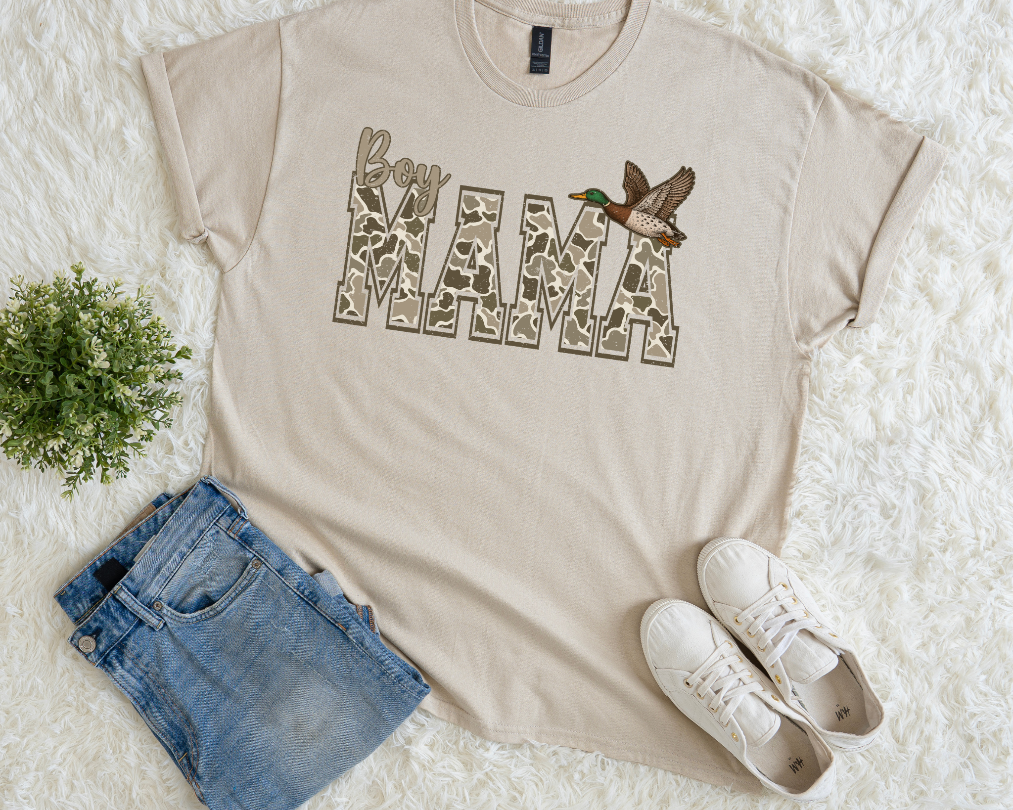 Boy Mama t-shirt in a neutral beige shade with camo block lettering and a flying duck graphic