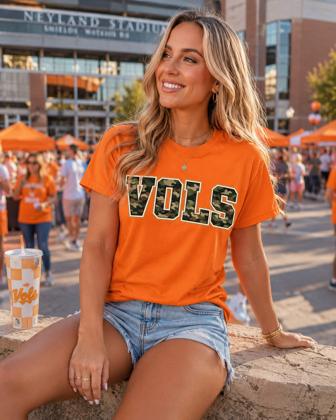 Woman wearing an orange 'VOLS' shirt at Neyland Stadium