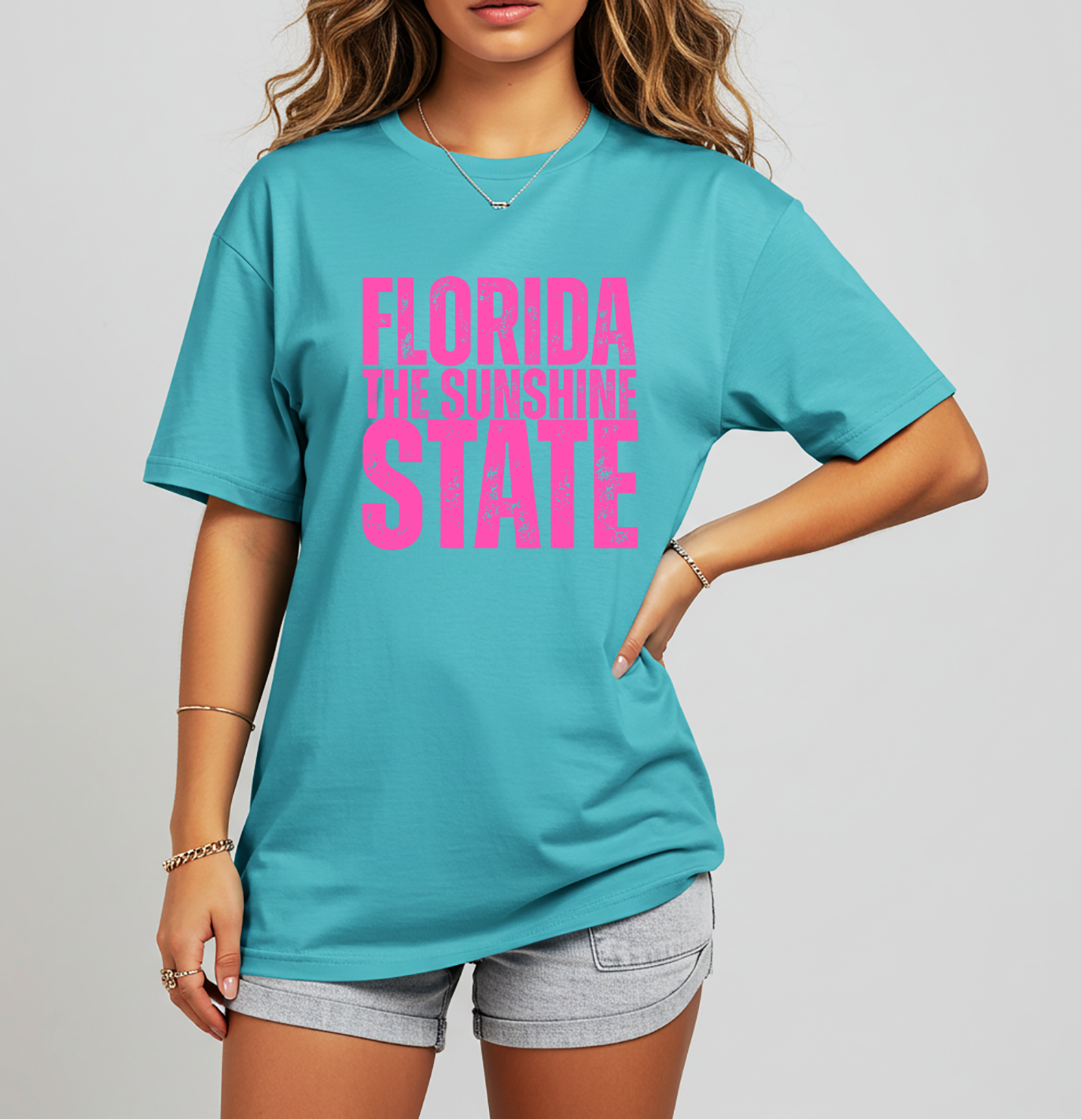 Florida The Sunshine State graphic tee with bold distressed lettering. Women’s summer t-shirt perfect for Florida vacations, beach trips, coastal wear, and tourist gift shops.