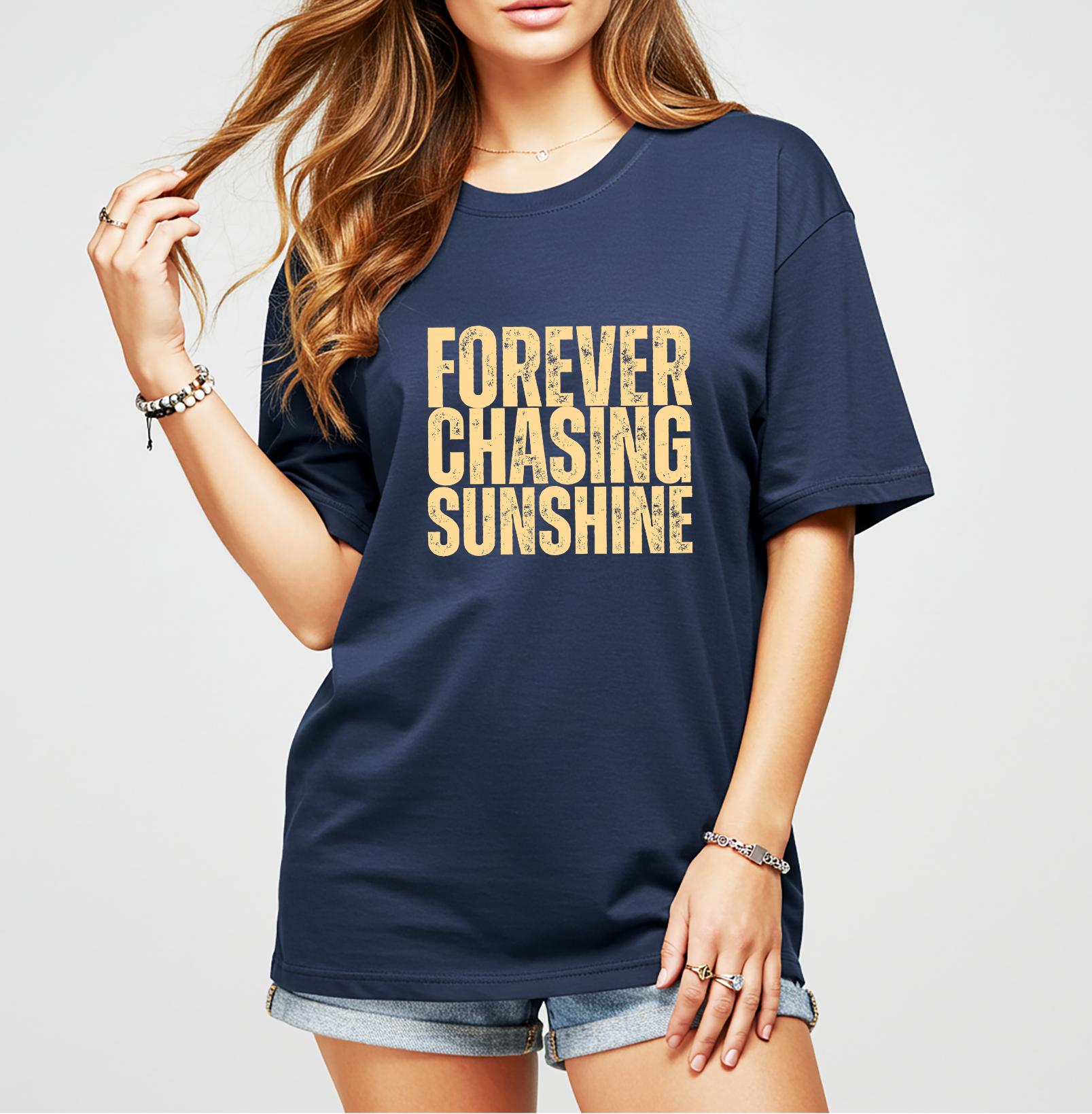 Forever Chasing Sunshine graphic tee on a navy t-shirt. Women’s summer top perfect for beach days, vacations, lake weekends, and casual warm-weather wear.