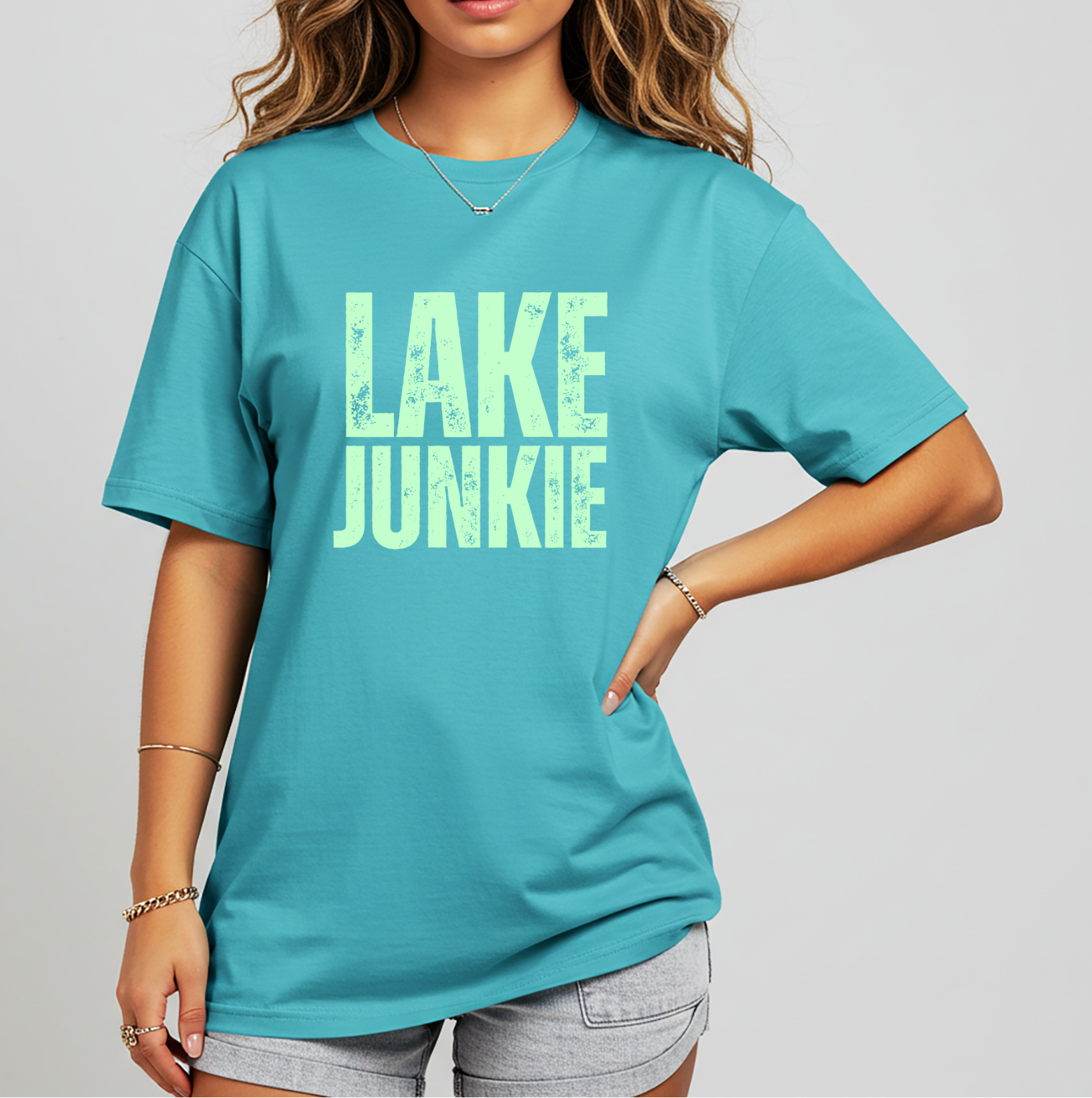 Lake Junkie graphic tee with distressed lettering. Women’s summer t-shirt for lake days, boat weekends, vacations, camping trips, and casual warm-weather wear