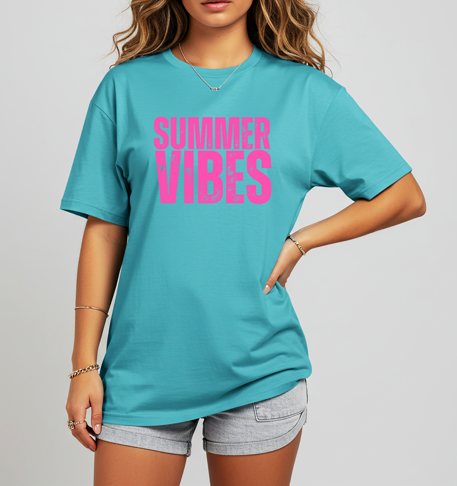 Summer Vibes graphic tee with bright pink lettering on a turquoise shirt. Women’s summer t-shirt perfect for beach trips, vacations, pool days, and lake weekends.