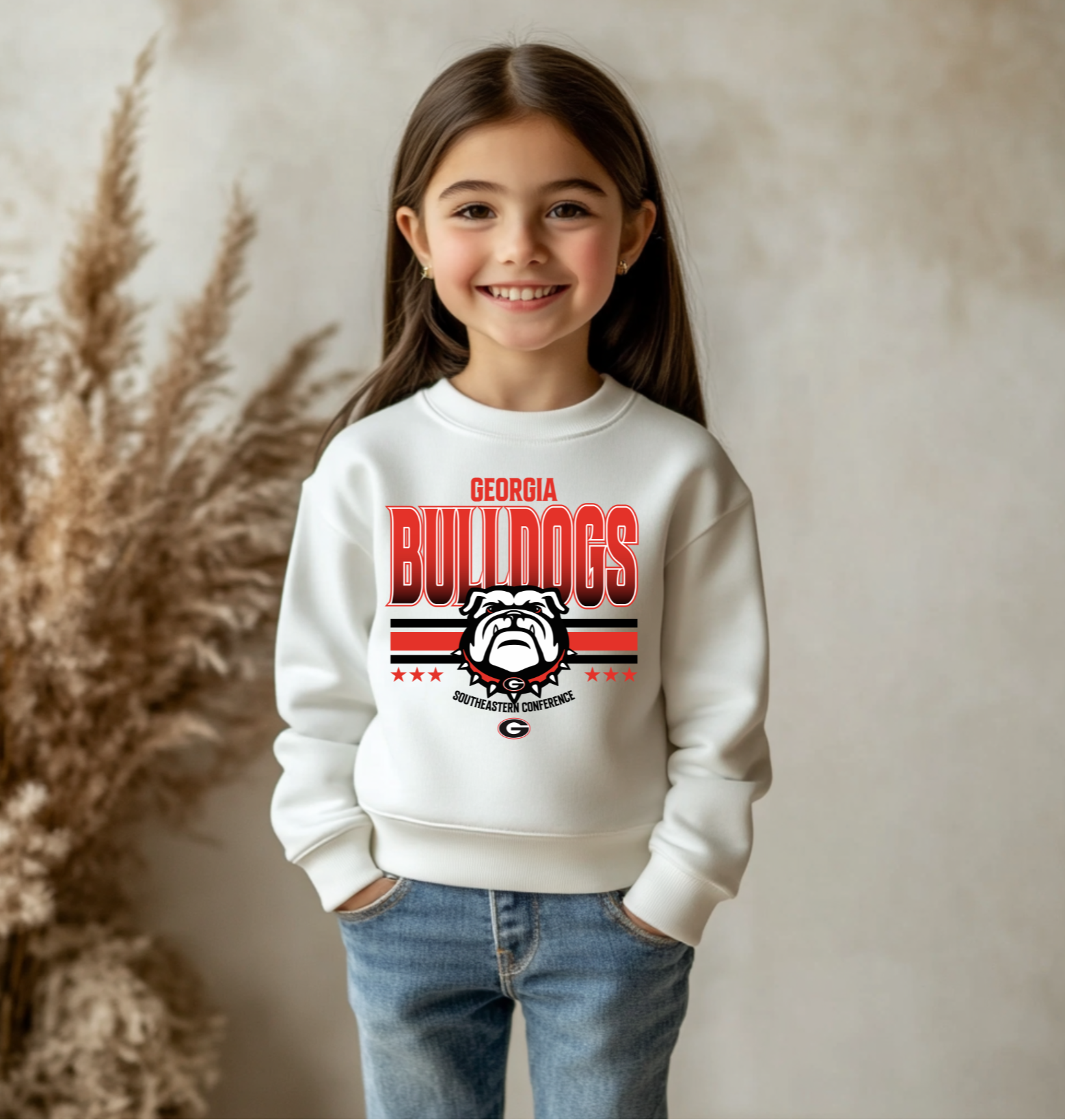 A youth-sized Georgia Bulldogs-inspired crewneck sweatshirt with bold red and black graphics and a bulldog design, made for kids who love showing their game day spirit.