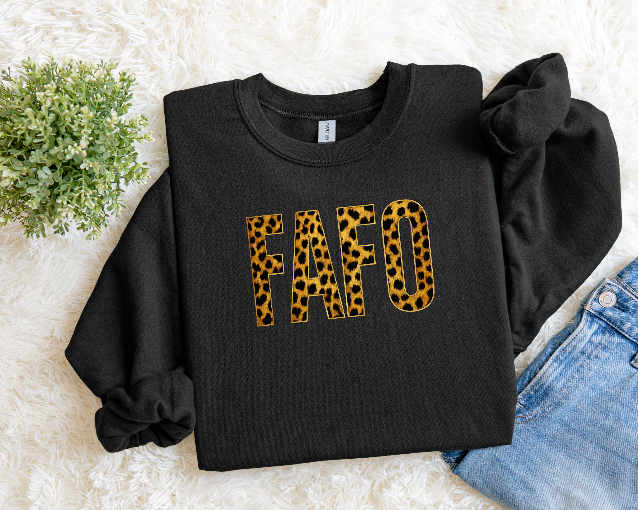 Black sweatshirt with 'FAFO' in leopard print on a light background
