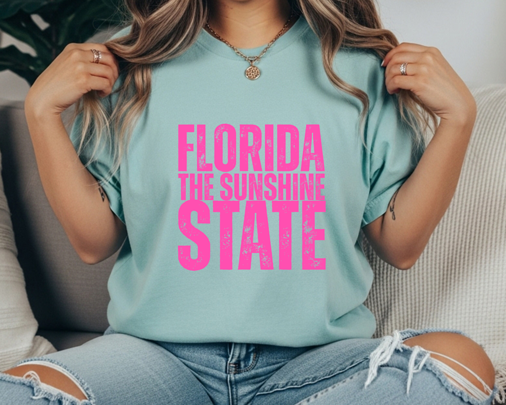 Comfort Colors t-shirt with bright hot pink distressed text that reads “Florida The Sunshine State” in stacked lettering.