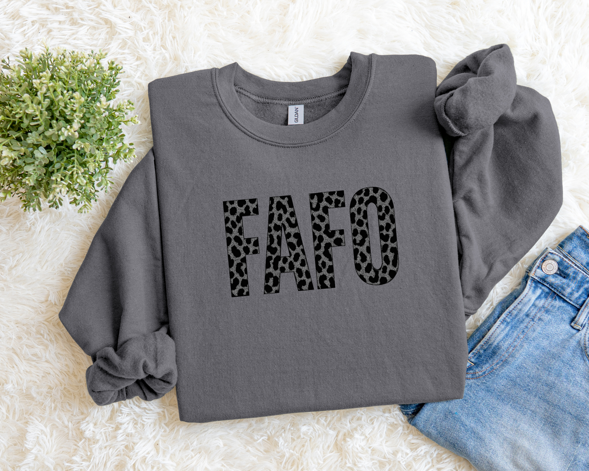 Gray sweatshirt with 'FAFO' in leopard print on a light background