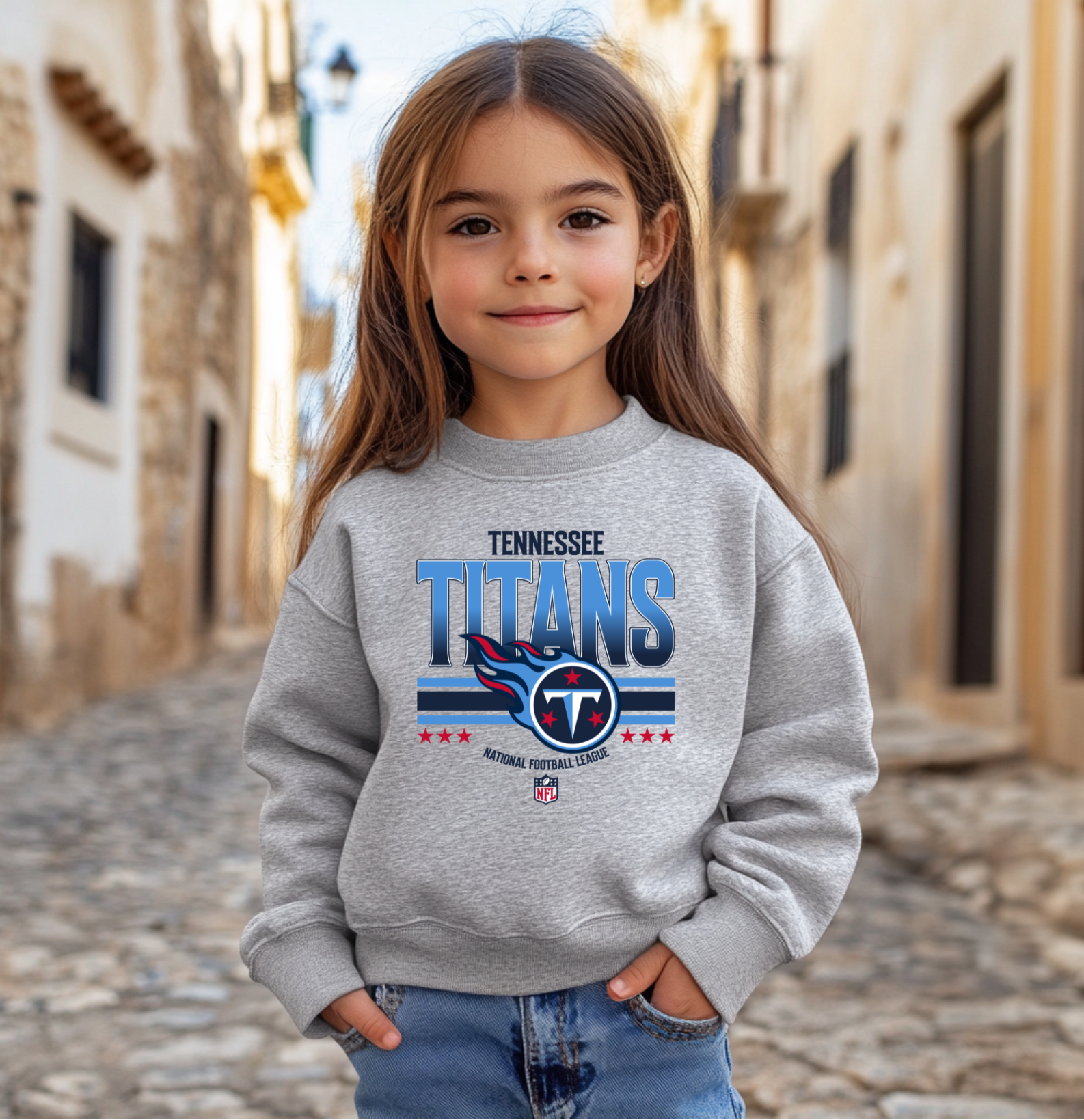 A youth-sized Tennessee Titans-inspired crewneck sweatshirt featuring bold blue and red team-style graphics on a soft gray fabric, perfect for kids who love football.
