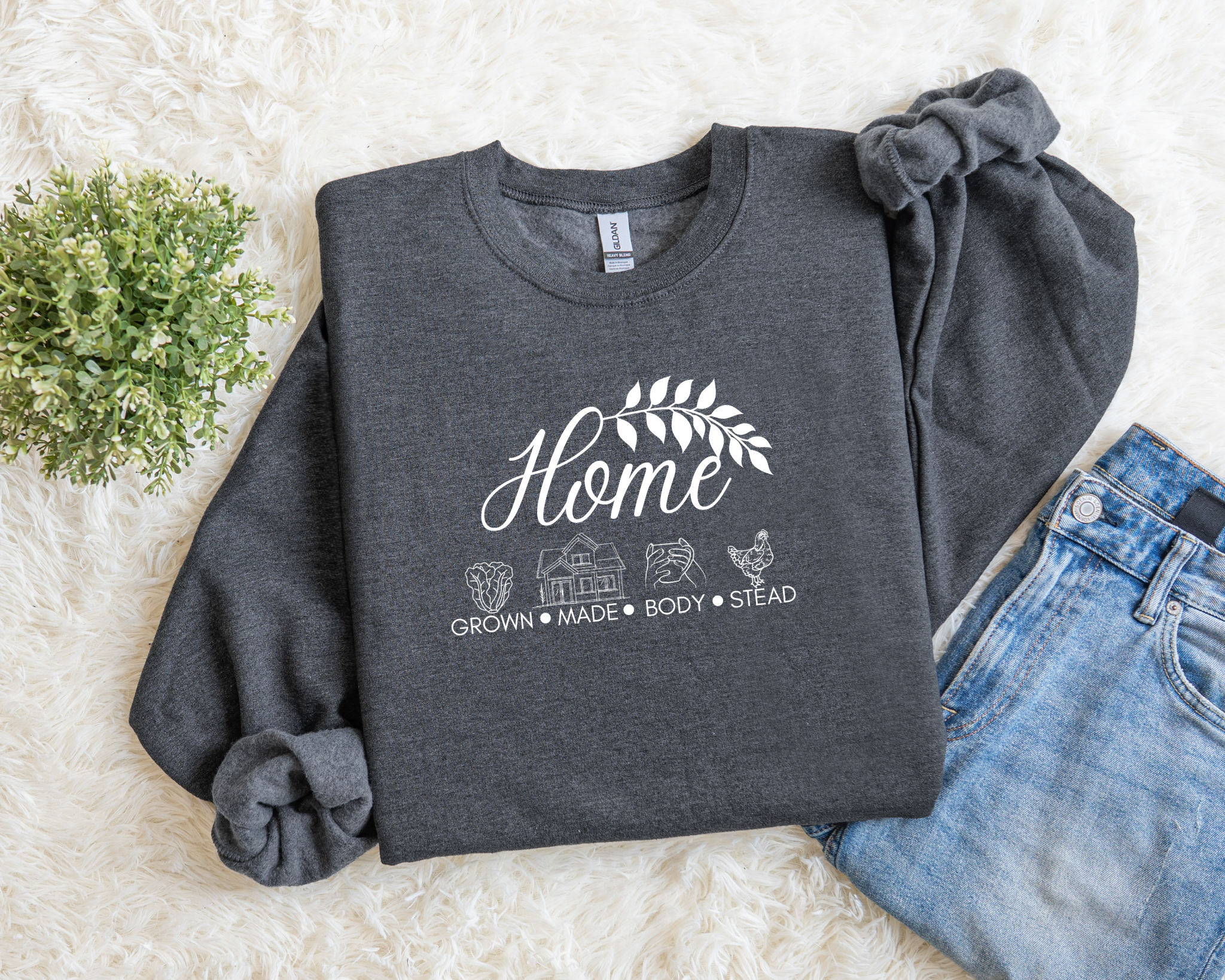 Dark gray sweatshirt with white text and graphics on a light background