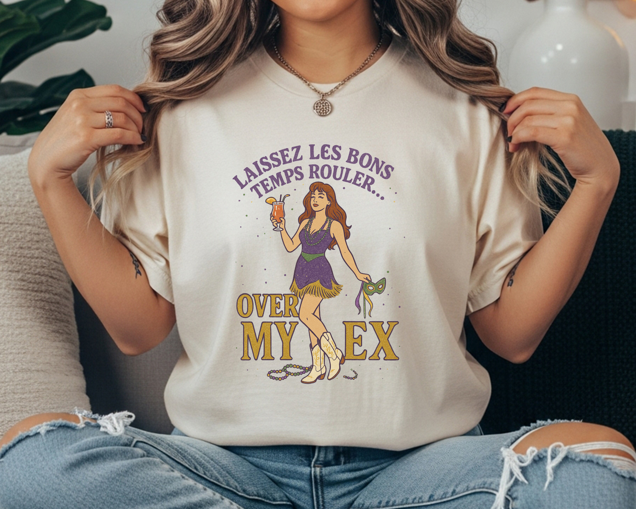 Comfort Colors tee featuring Mardi Gras design with cowgirl holding a mask and drink, text reads “Laissez Les Bons Temps Rouler Over My Ex.”