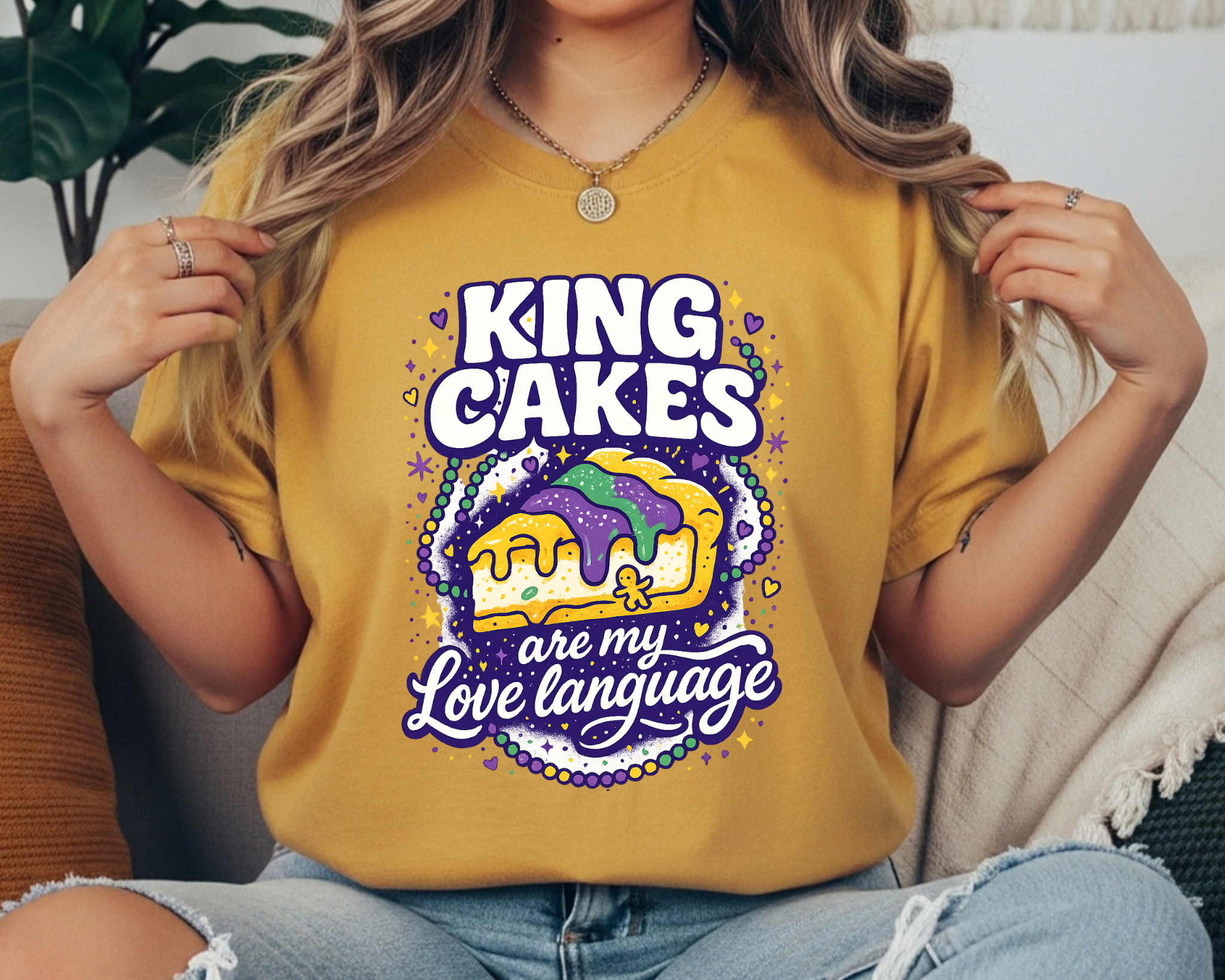 Mardi Gras t-shirt with a colorful king cake slice graphic and white lettering that says “King Cakes are my Love Language,” surrounded by hearts, stars, and confetti.