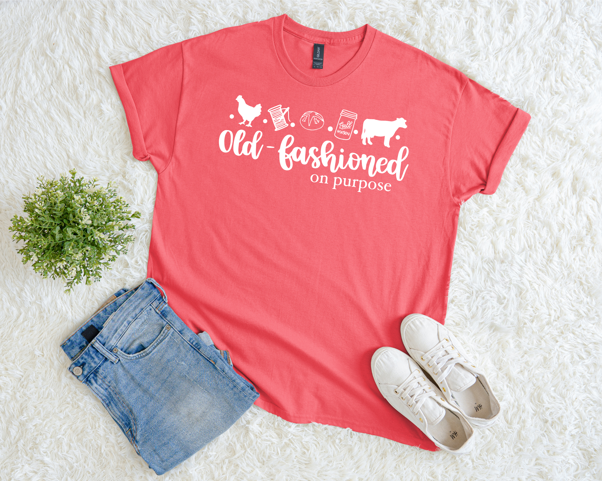 Red t-shirt with 'Old Fashioned on Purpose' text, blue shorts, and white sneakers on a light background