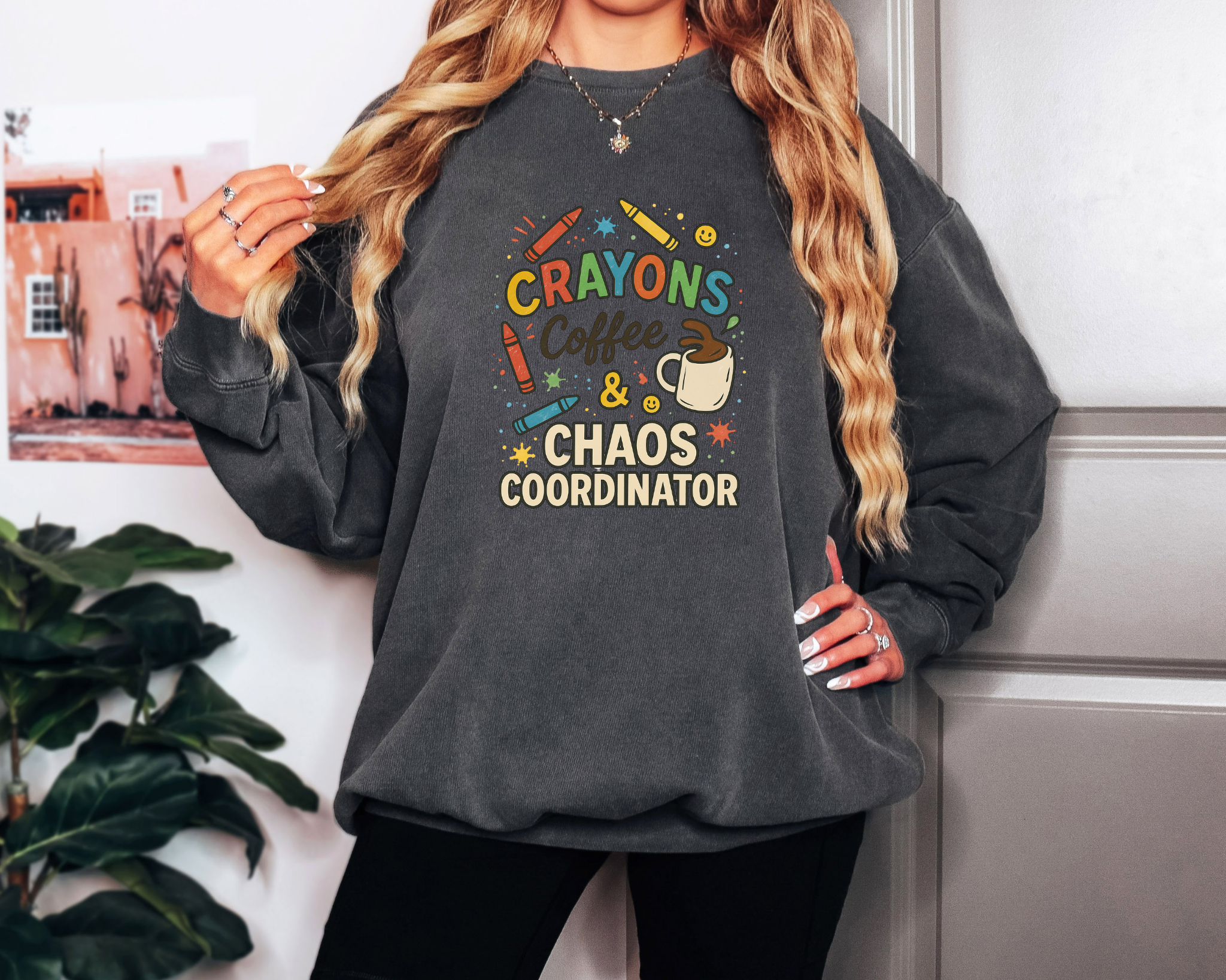 pepper Comfort Colors crewneck sweatshirt with “Crayons, Coffee & Chaos Coordinator” in colorful text and classroom doodles.