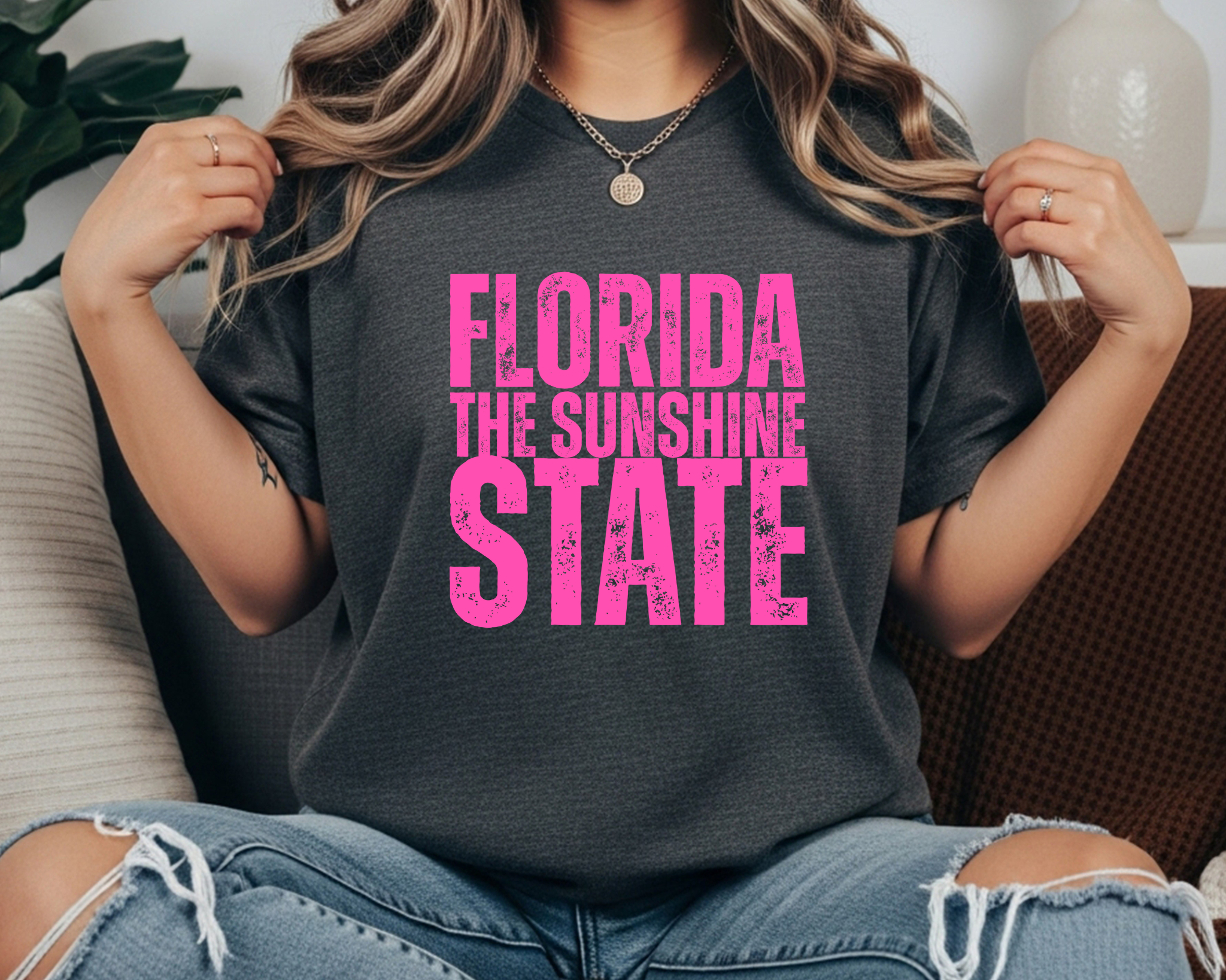 Comfort Colors t-shirt with bright hot pink distressed text that reads “Florida The Sunshine State” in stacked lettering.