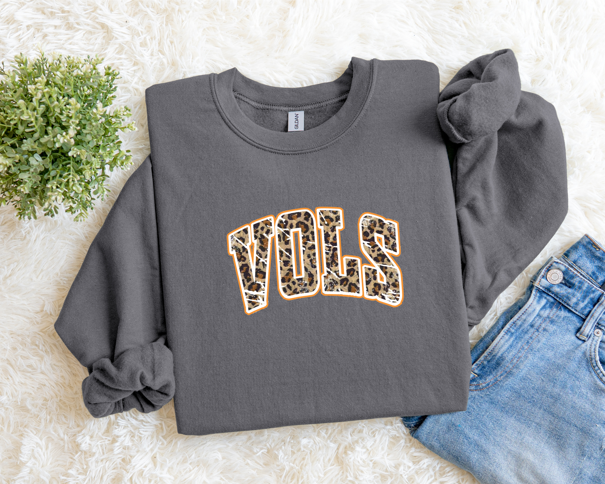 sweatshirt featuring a bold leopard print “VOLS” design outlined in orange