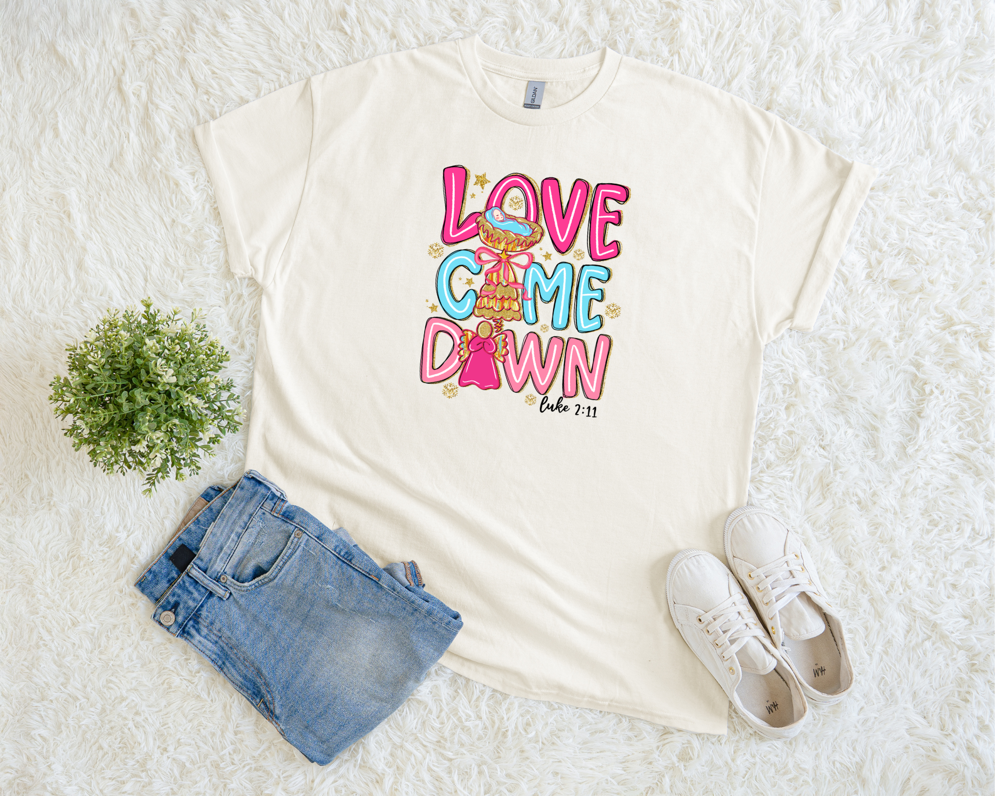 t-shirt with colorful “Love Came Down” text and Luke 2:11 Bible verse