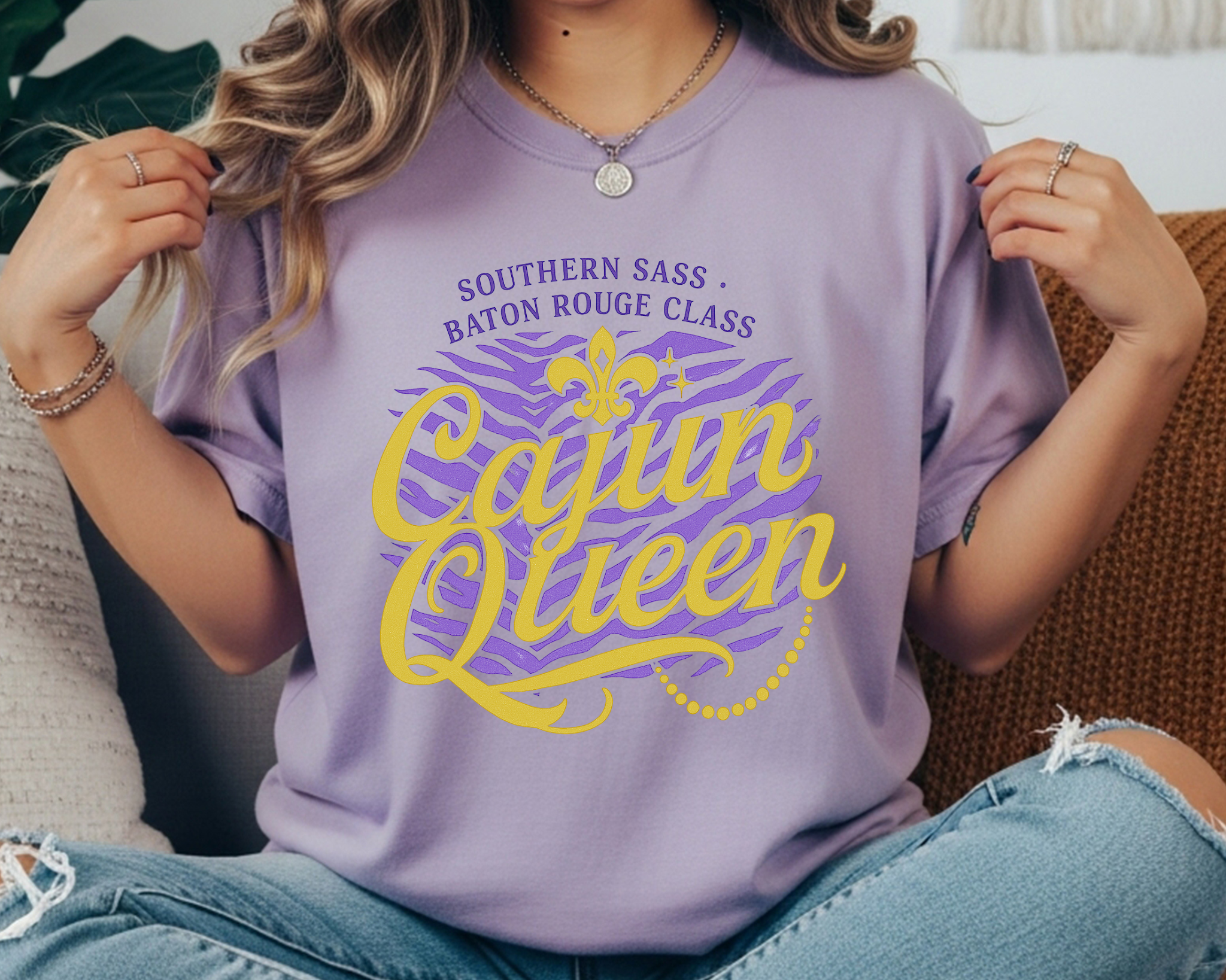 violet Comfort Colors tee with gold and purple text reading “Cajun Queen – Southern Sass, Baton Rouge Class” with fleur-de-lis and zebra print.