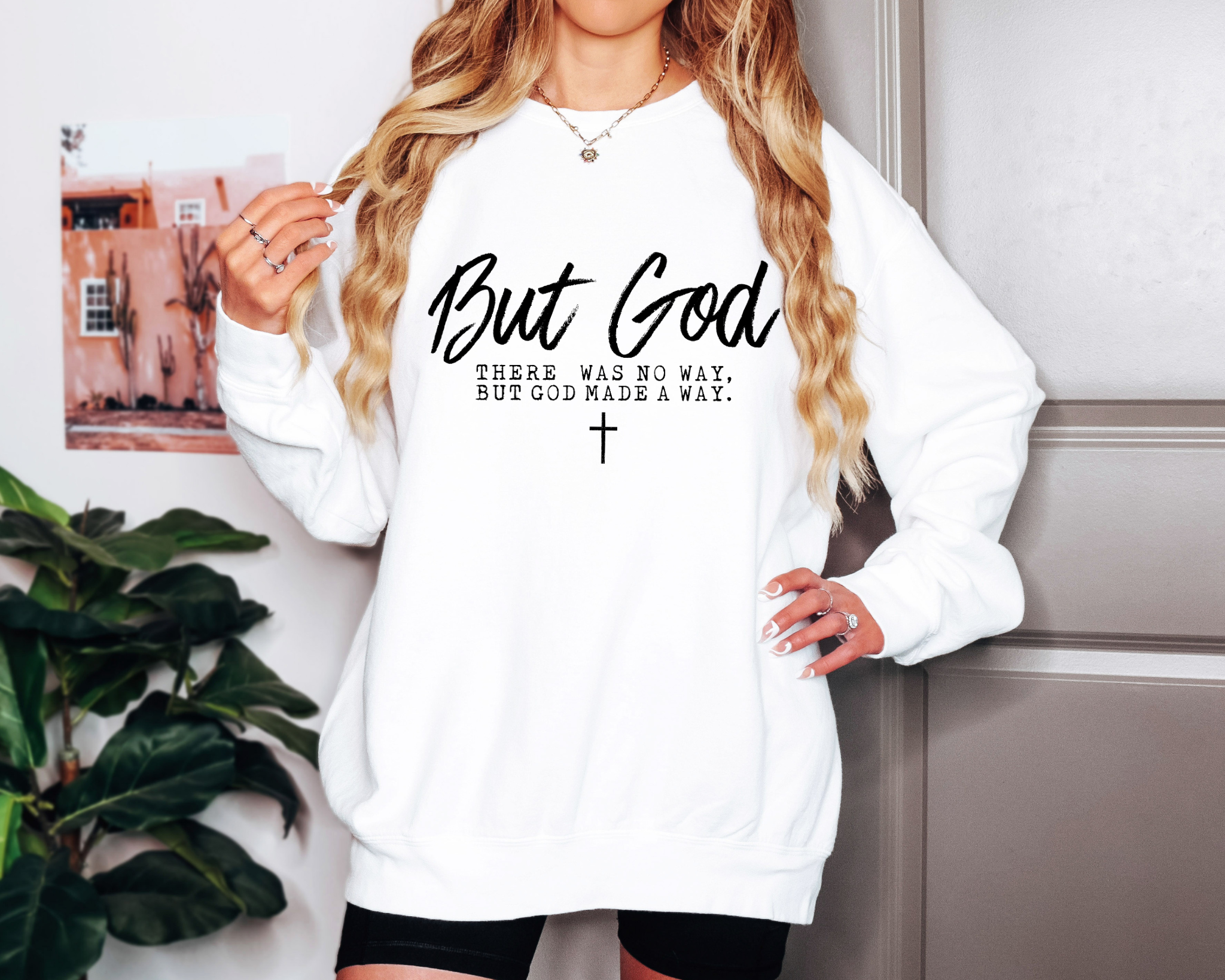 white Comfort Colors crewneck sweatshirt with “But God — There was no way, but God made a way” white script design and cross graphic.